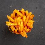 top-view-delicious-french-fries-dark-background-fast-food-potato-dish-burger-meal